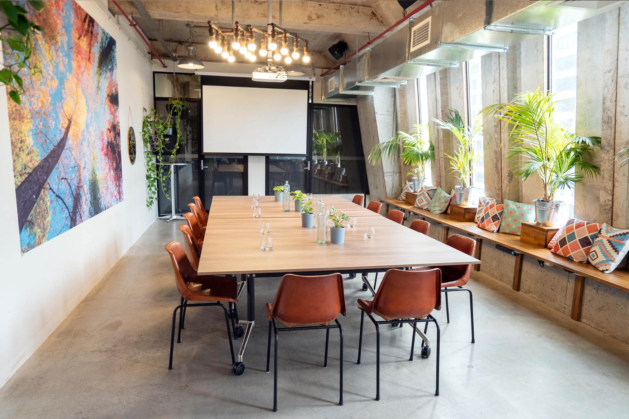 Warehouse 21 event space in Melbourne set up with a large boardroom table facing the projector